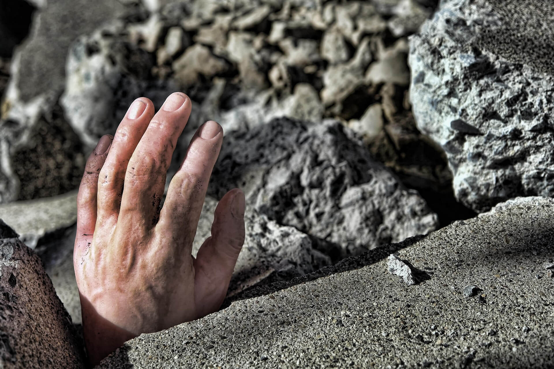 photo of person under rubble