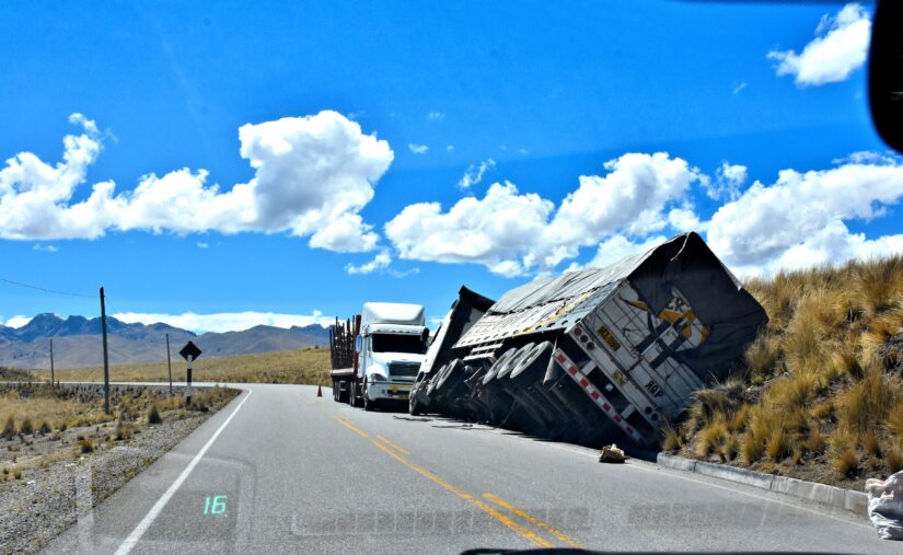 Two trucks by the right side of the read