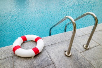 life preserver lying next to a pool after a Florida swimming pool accident