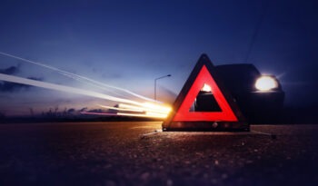 A car is stopped on the road. A fatal car accident lawyer in Destin can help you after a crash.